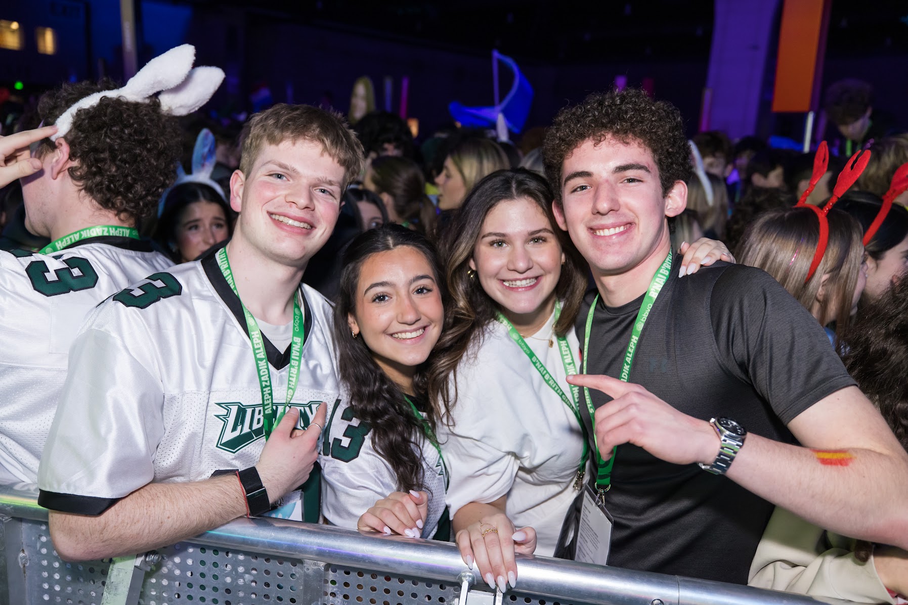 Group of diverse young people smiling at a community event
