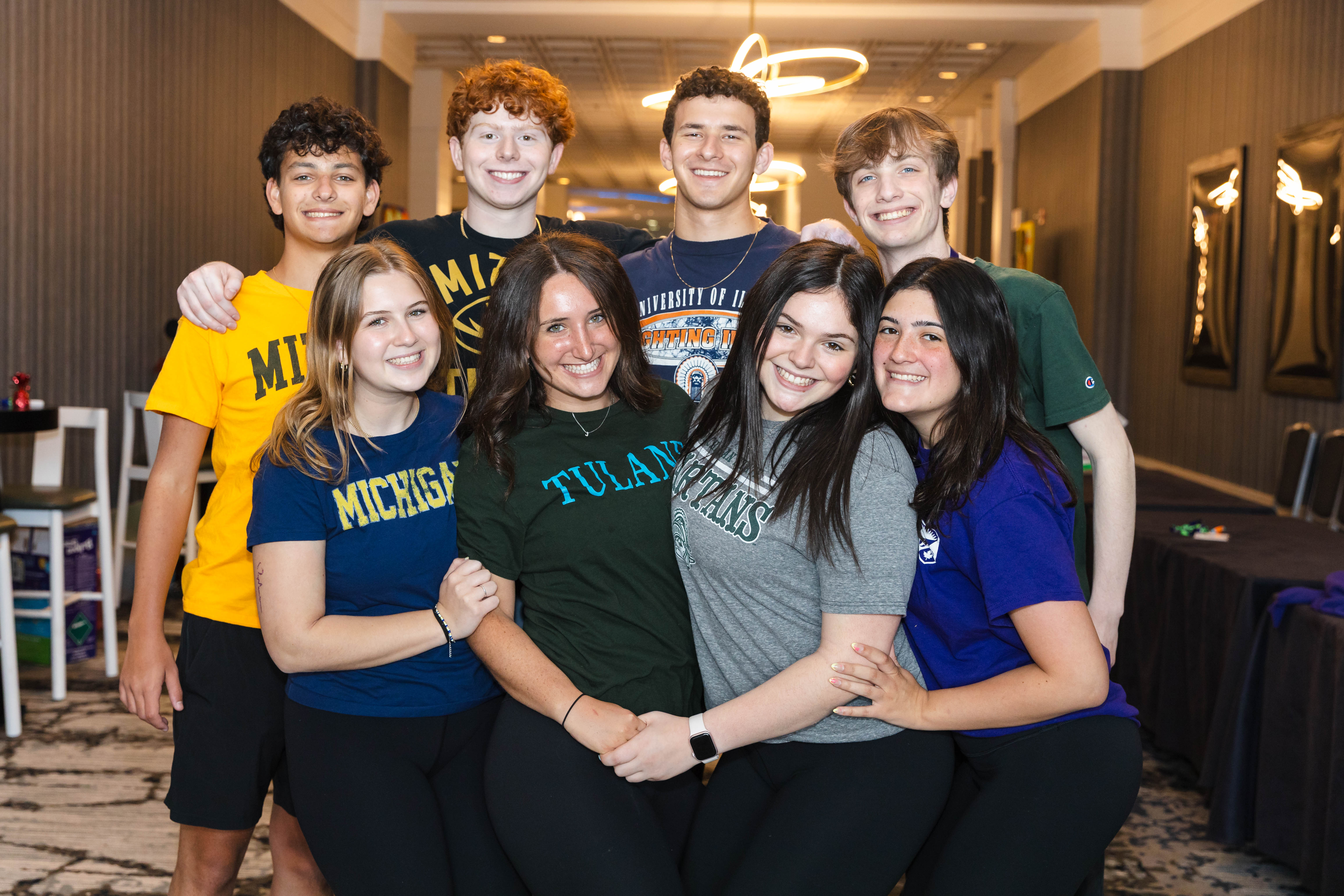 Group of diverse young people smiling at a community event