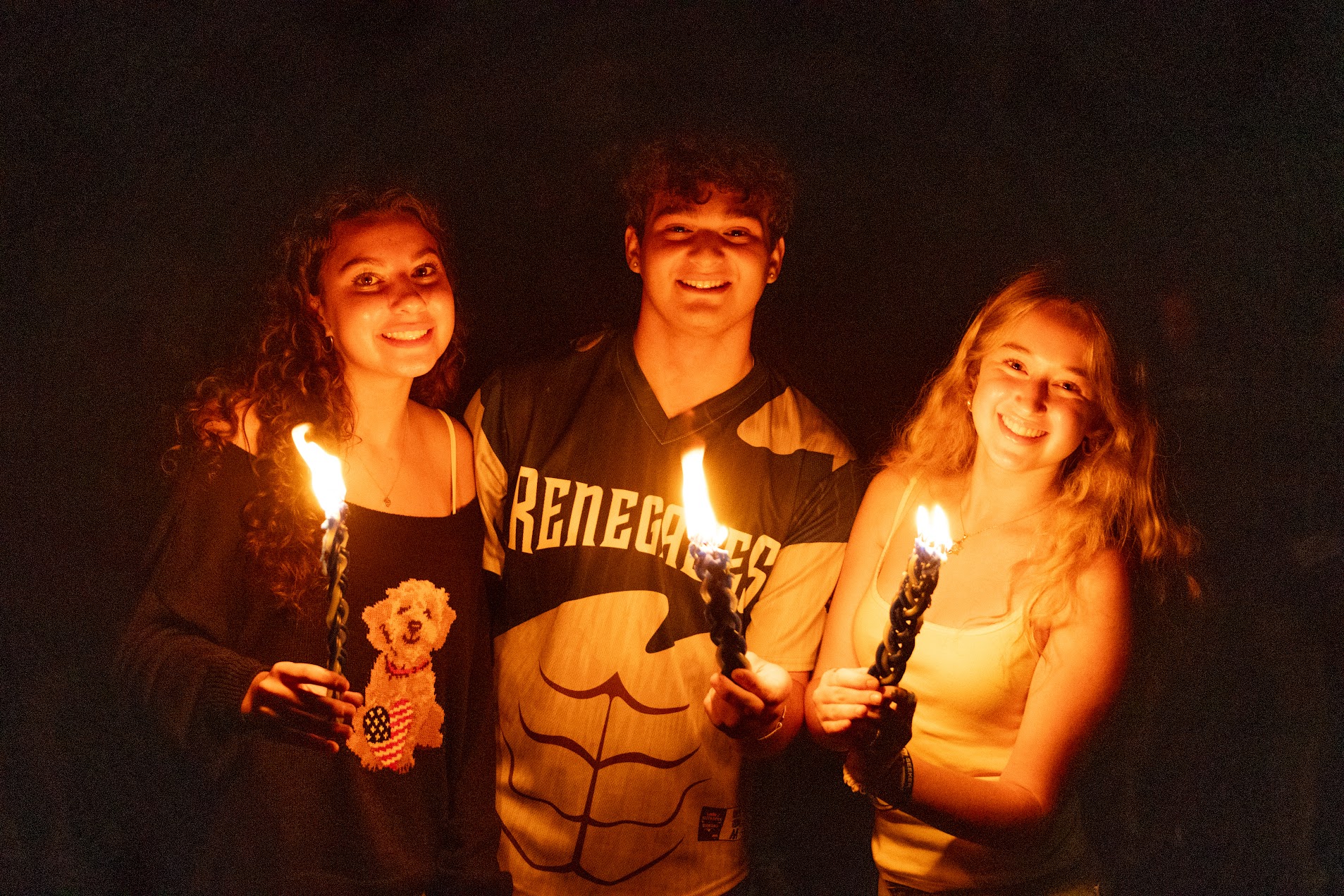 Group of diverse young people smiling at a community event