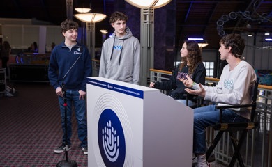 Group of three smiling parents at a community event