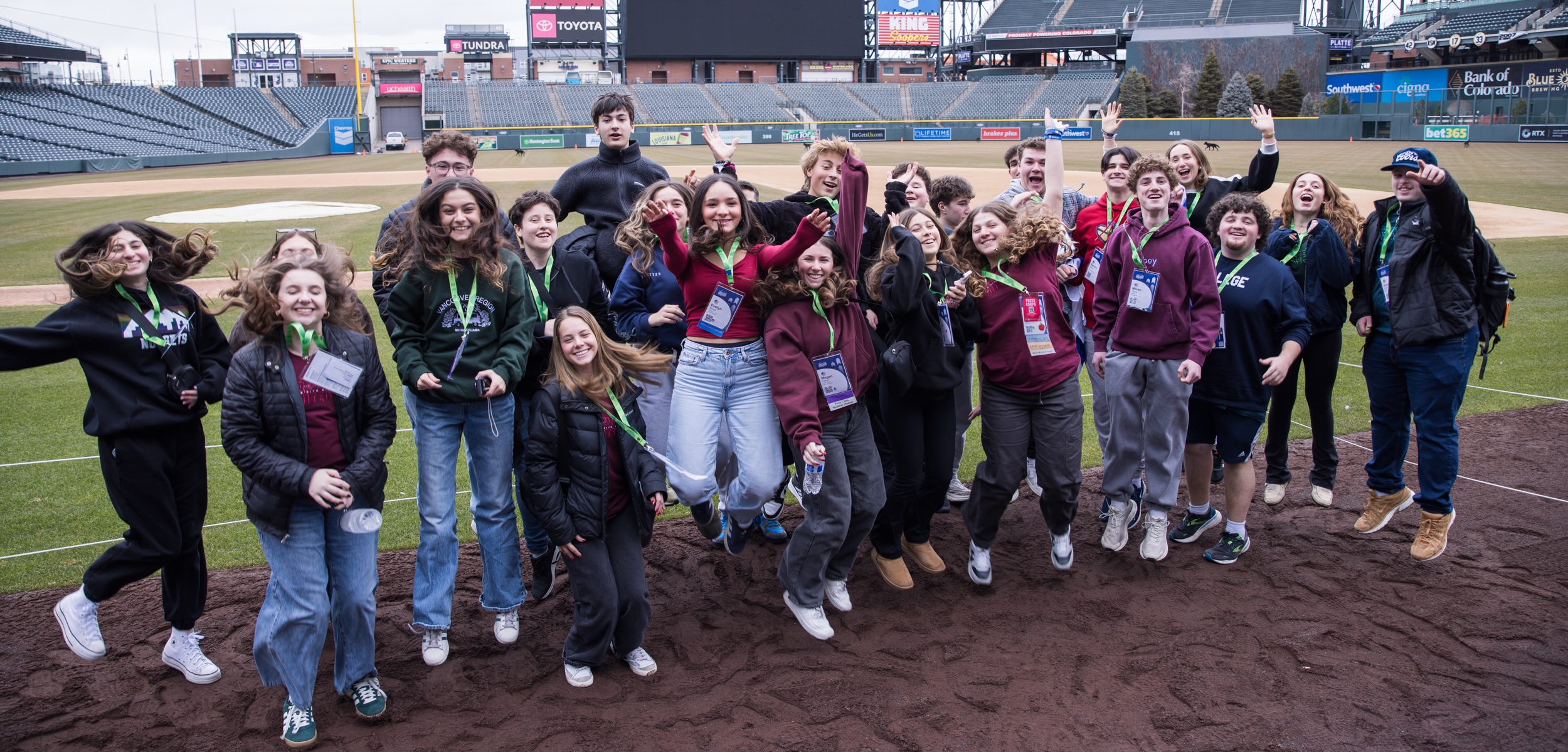 Group of diverse young people smiling at a community event