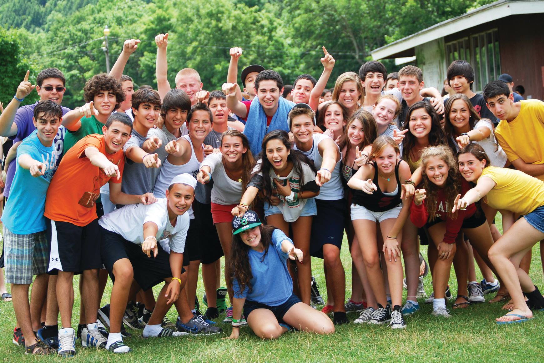 Group of diverse young people smiling at a community event