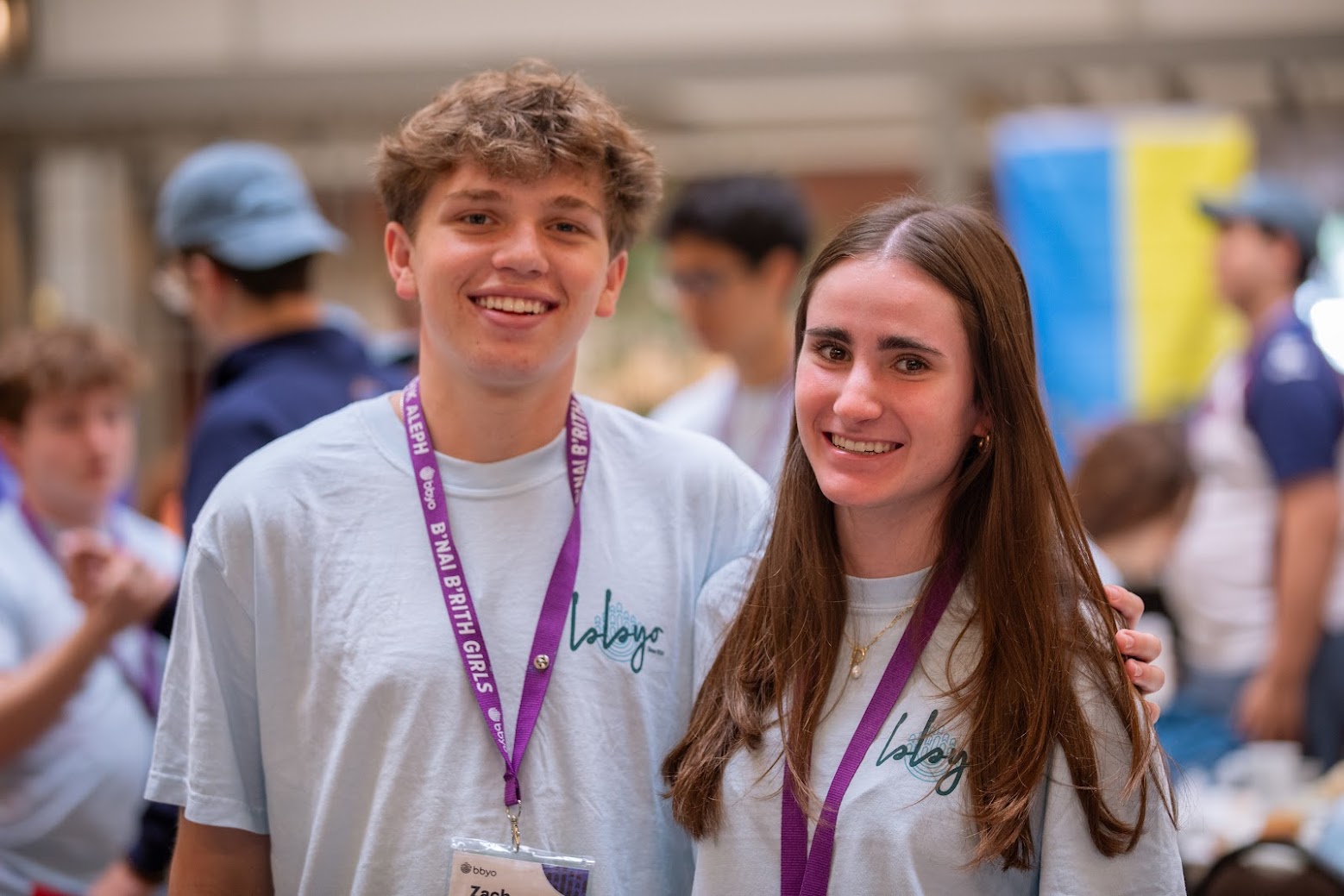 Group of diverse young people smiling at a community event