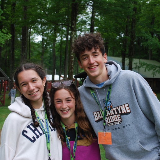 Three friends sitting on a hammock