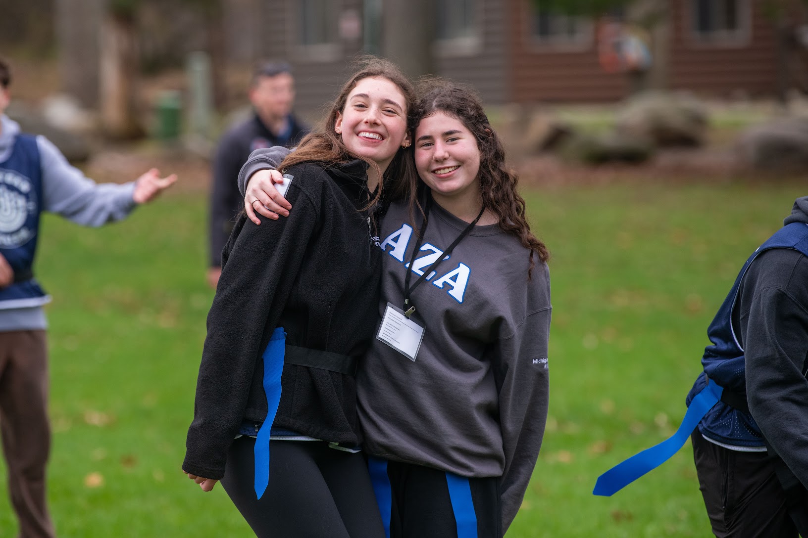 Group of diverse young people smiling at a community event