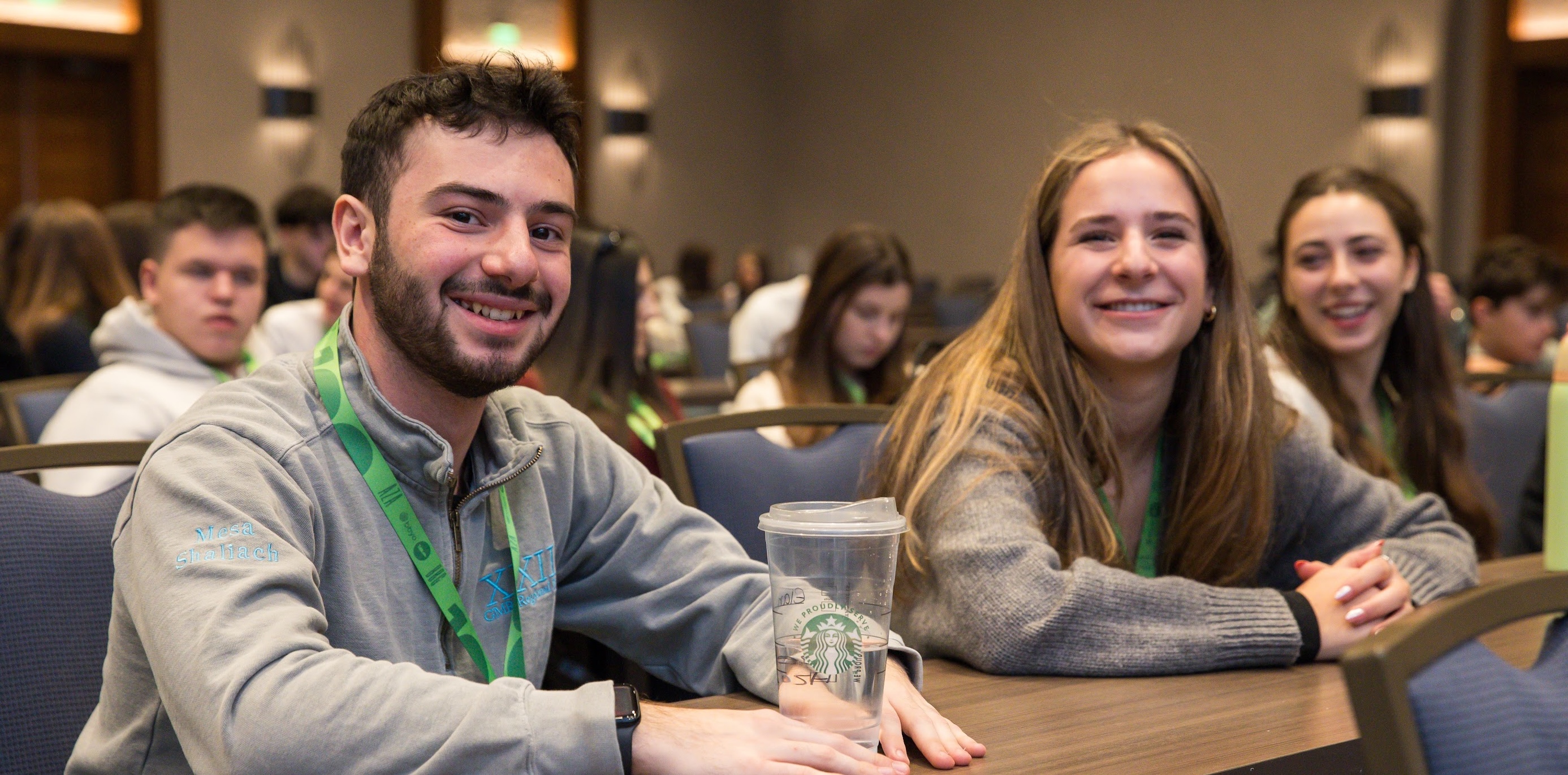 Group of diverse young people smiling at a community event