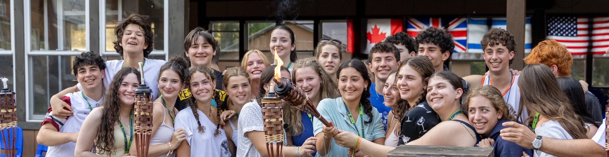 Group of diverse young people smiling at a community event