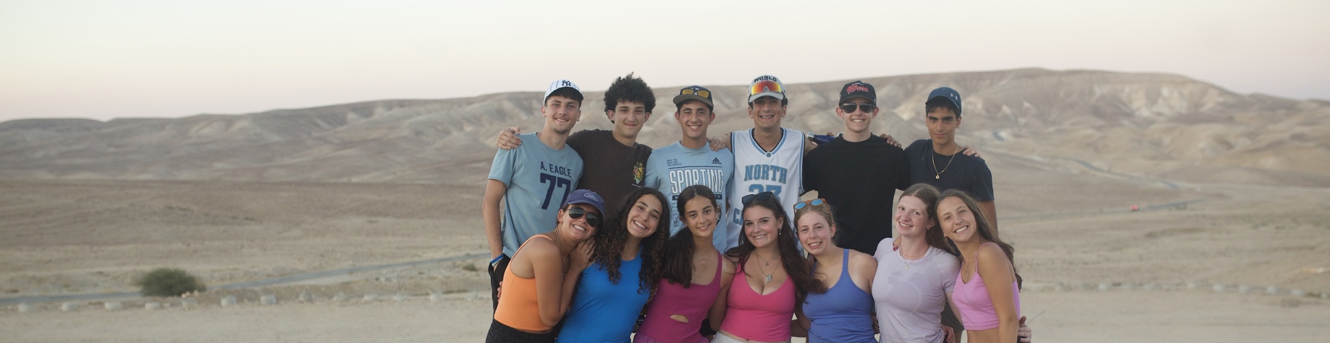 Group of diverse young people smiling at a community event