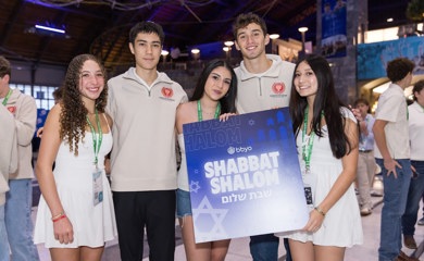 Group of three smiling parents at a community event