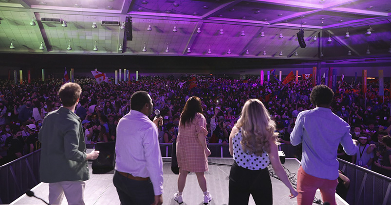Group of diverse young people smiling at a community event