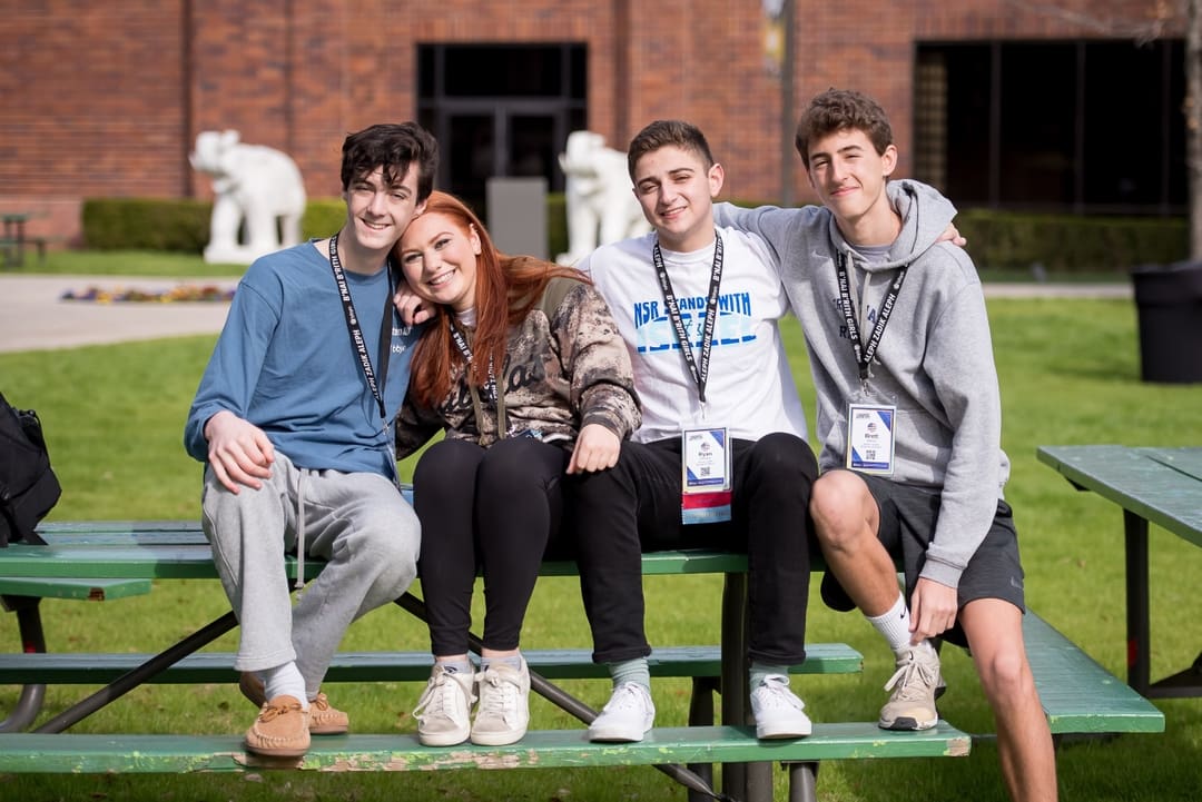 Group of diverse young people smiling at a community event