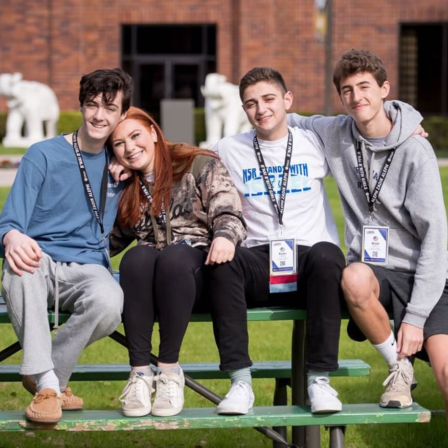 Group of people smiling outdoors