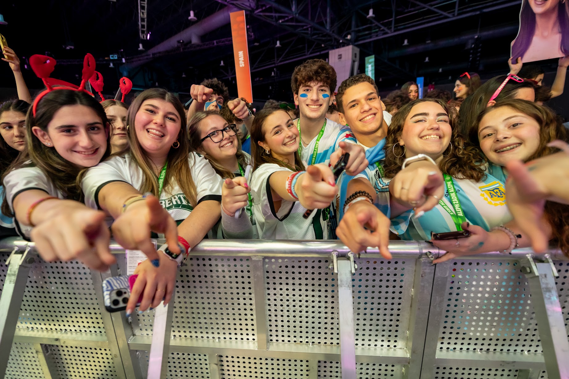 Group of diverse young people smiling at a community event