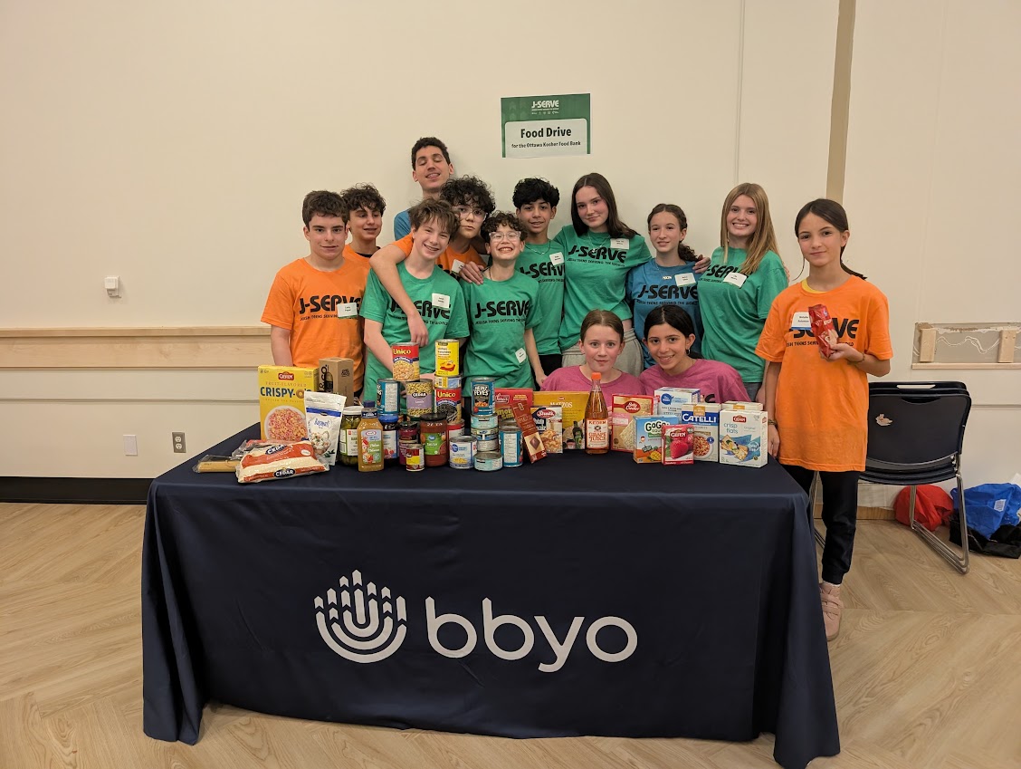 Group of diverse young people smiling at a community event