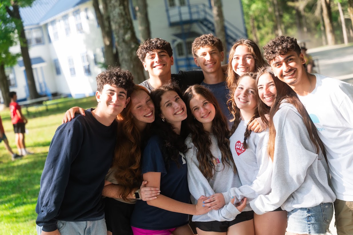 Group of diverse young people smiling at a community event
