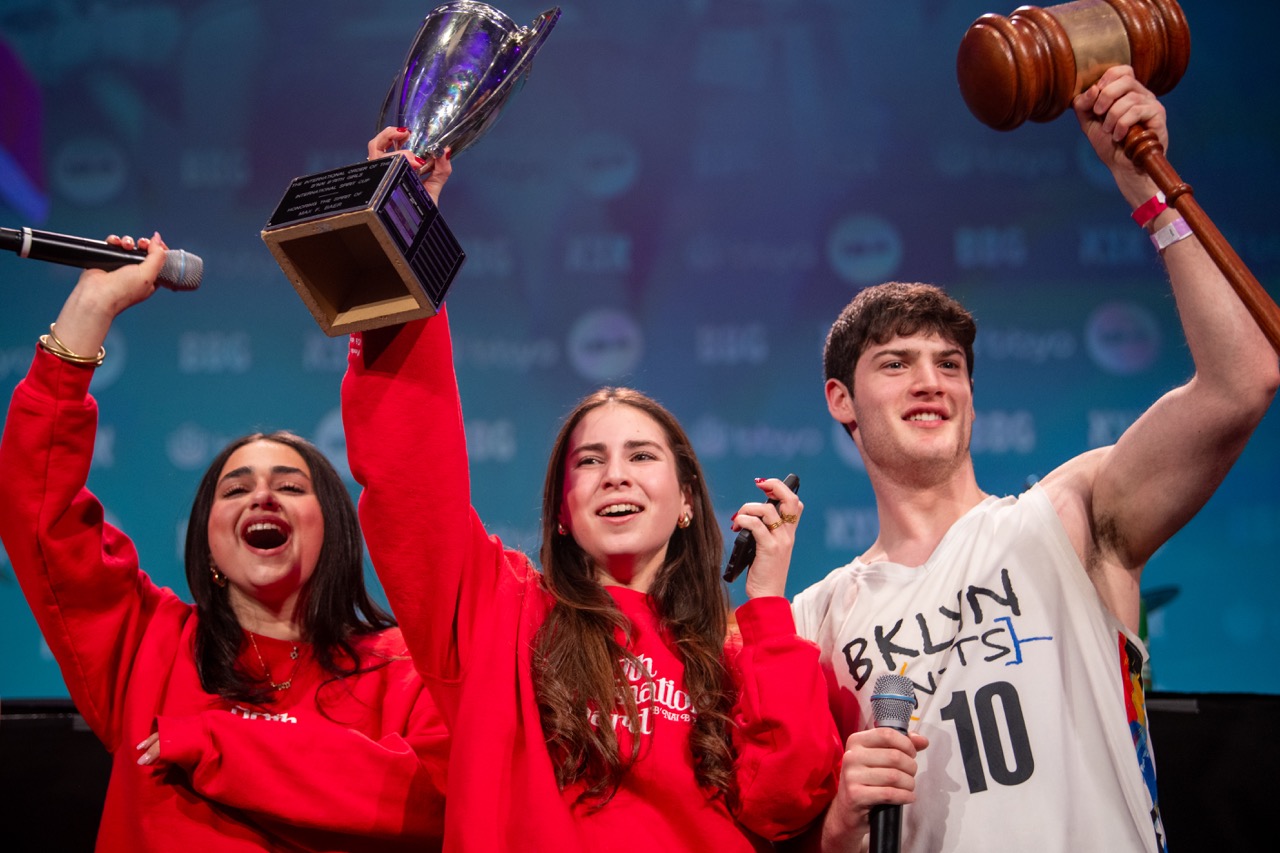Group of people celebrating on stage