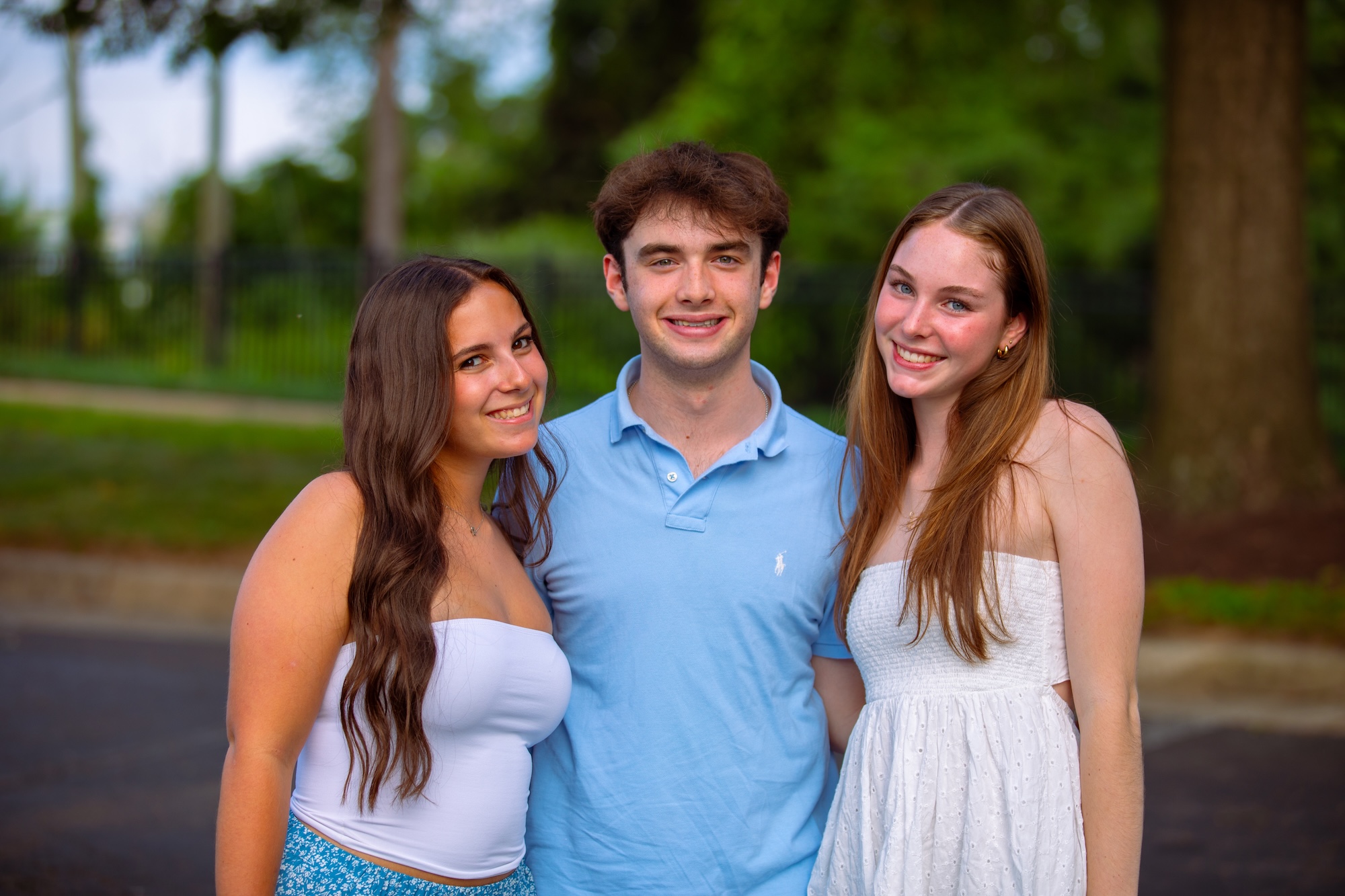 Three friends sitting on a hammock