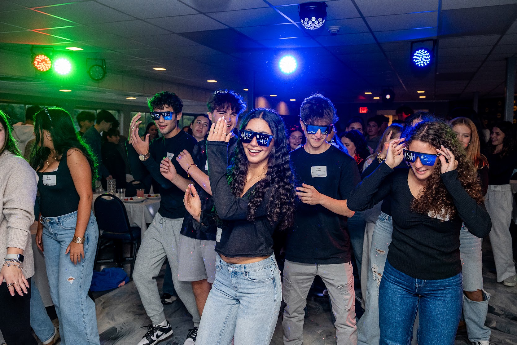 Group of diverse young people smiling at a community event