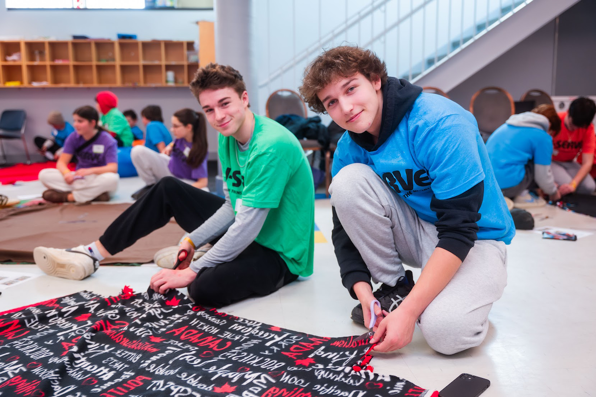 Group of diverse young people smiling at a community event