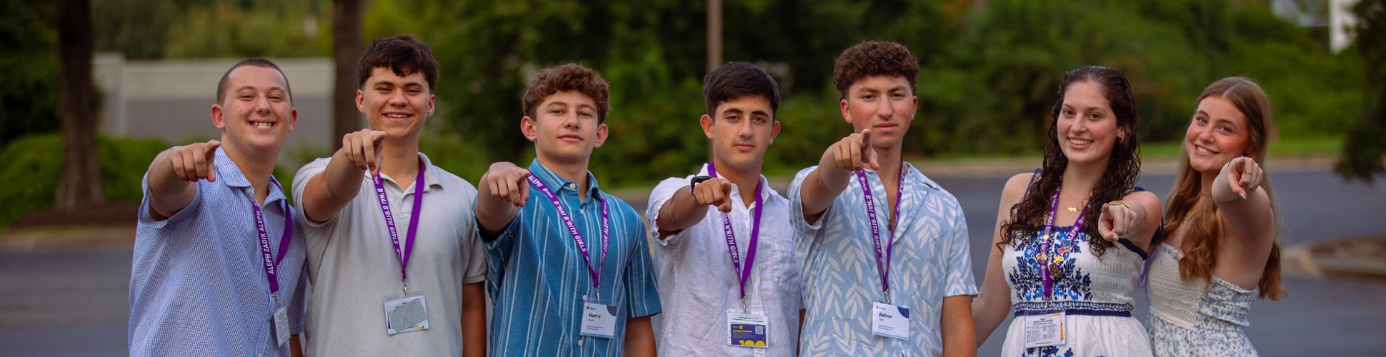 Group of diverse young people smiling at a community event